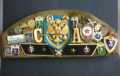 RUSSIAN ARMY CAP DECORATED WITH 6 CLOTH BADGES & 30 PIN BADGES